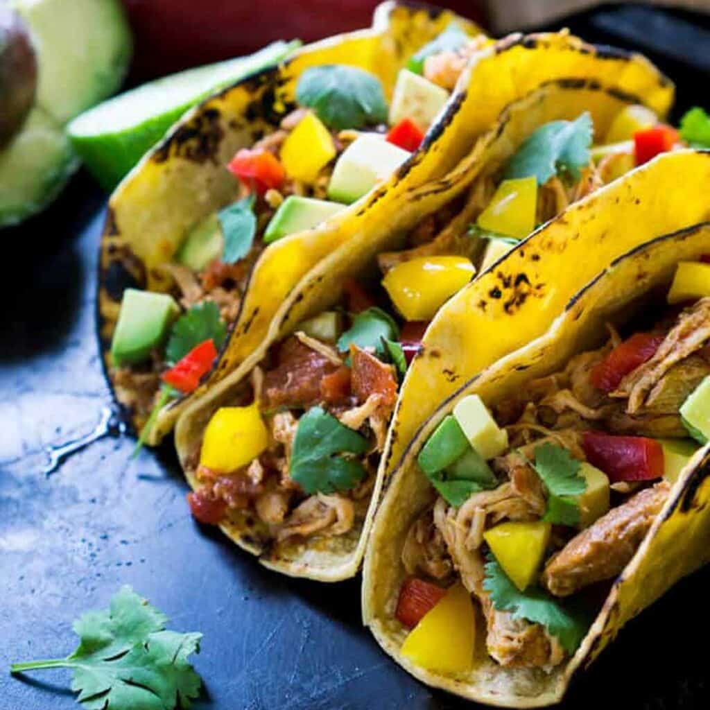 three chicken soft tacos