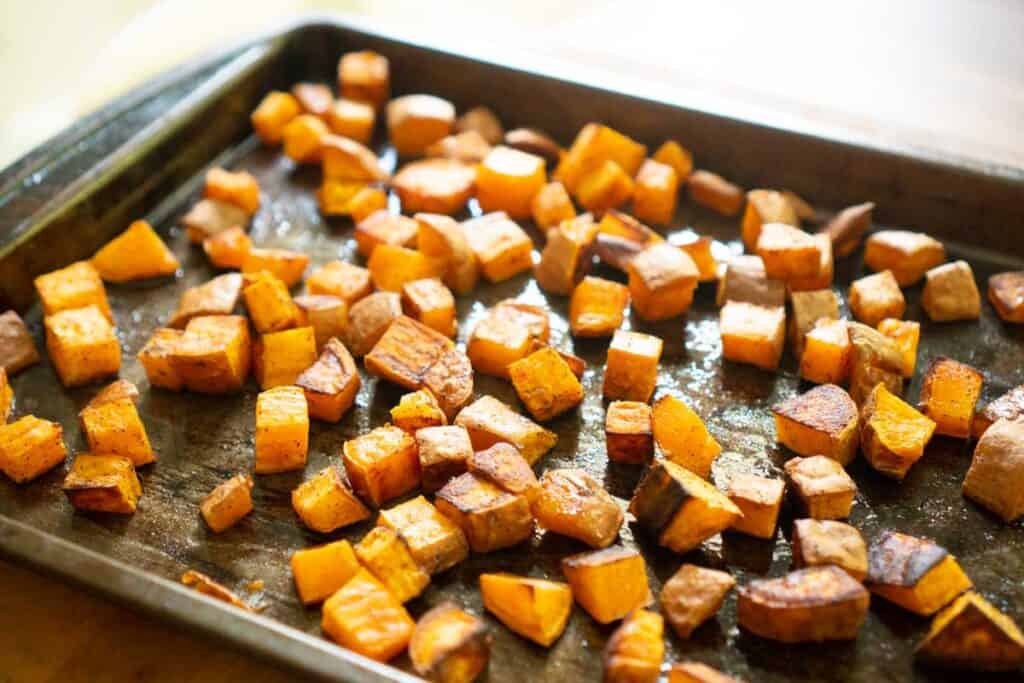 roasted diced sweet potatoes on baking sheet