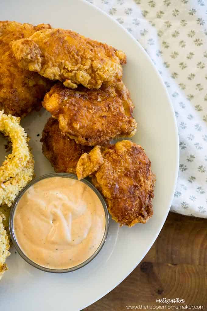 Chicken tenders next to a copy cat Zaxby's sauce 