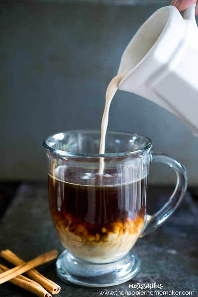 pumpkin spice creamer being poured into a glass