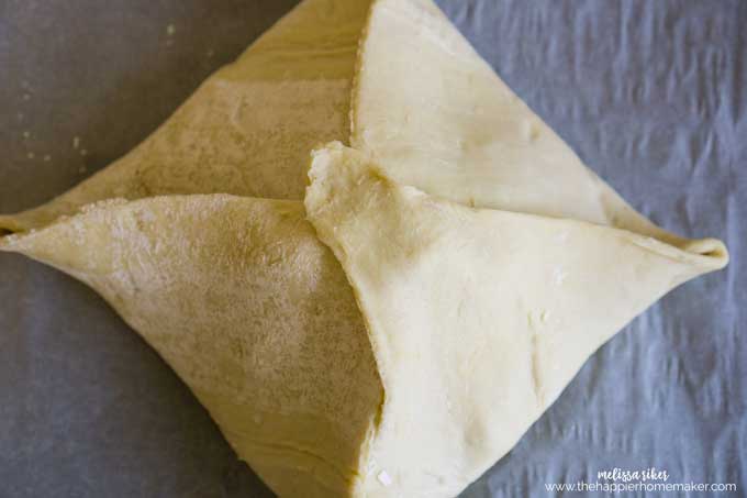 An above picture pastry wrapped brie before cooking