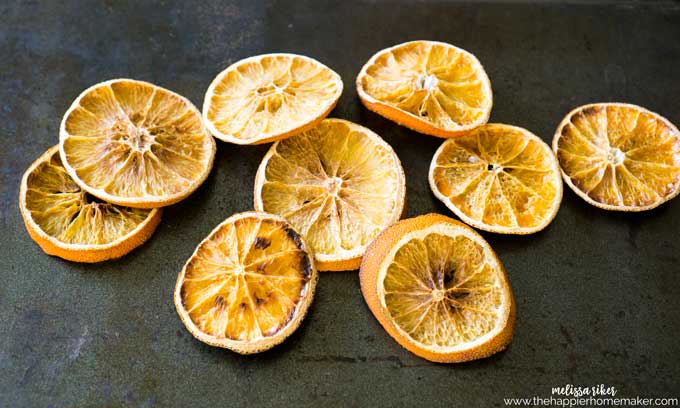 Several dried orange slices after baking on a pan