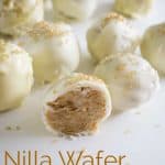 A close up of Nilla Wafer truffles showing the peanut butter inside of one truffle