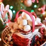A red basket full of white almond snowball cookies