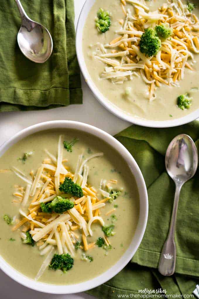 Two bowls of broccoli Cheese Soup from overhead