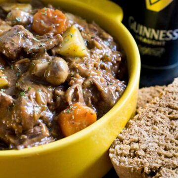 guinness beef stew in yellow bowl