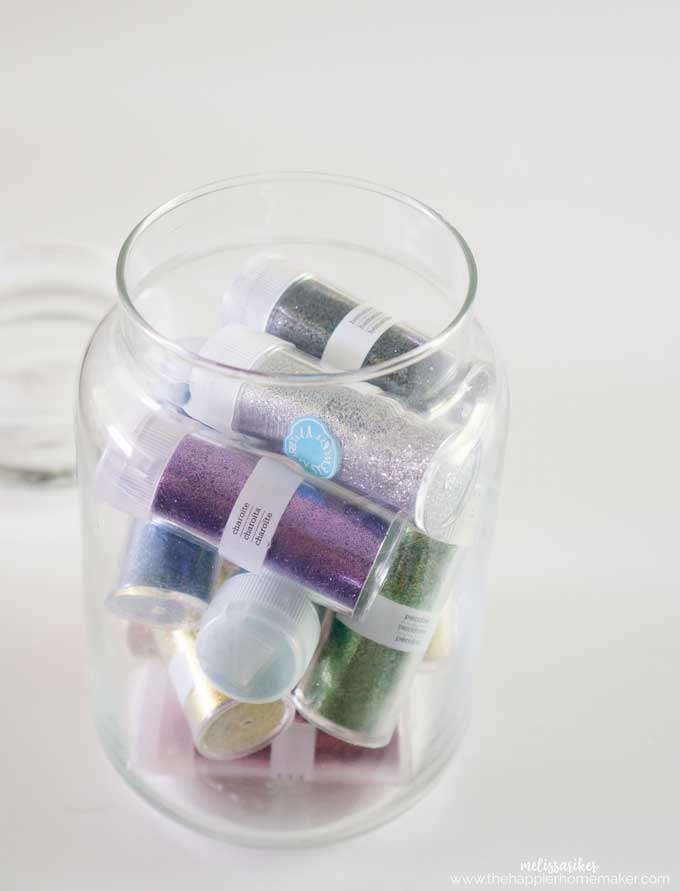 jar with vials of glitter