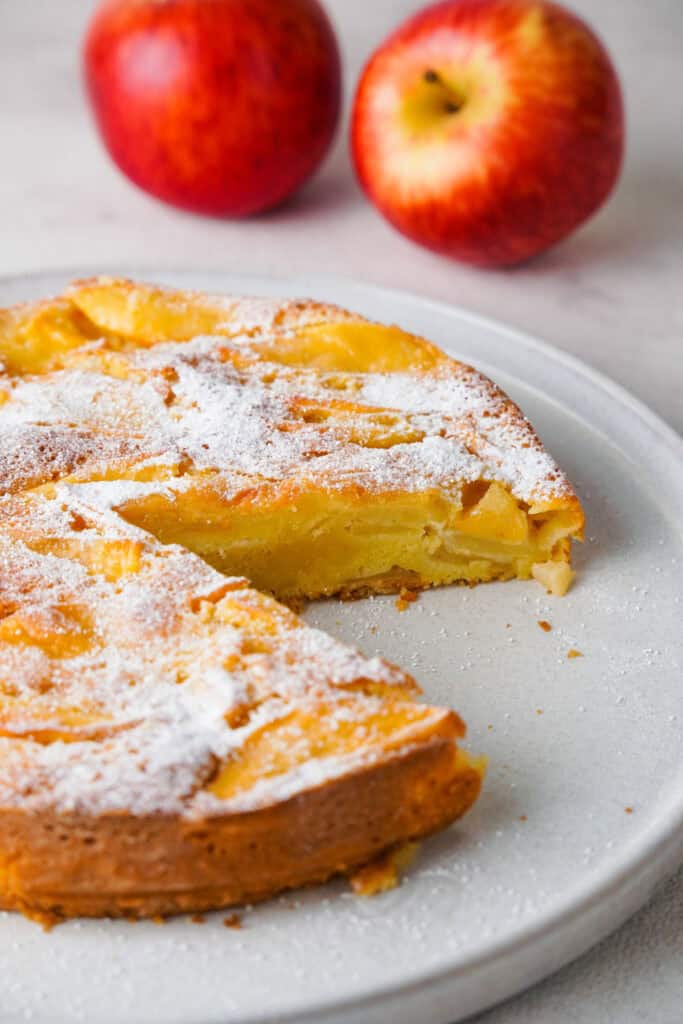 French apple cake with one slice removed