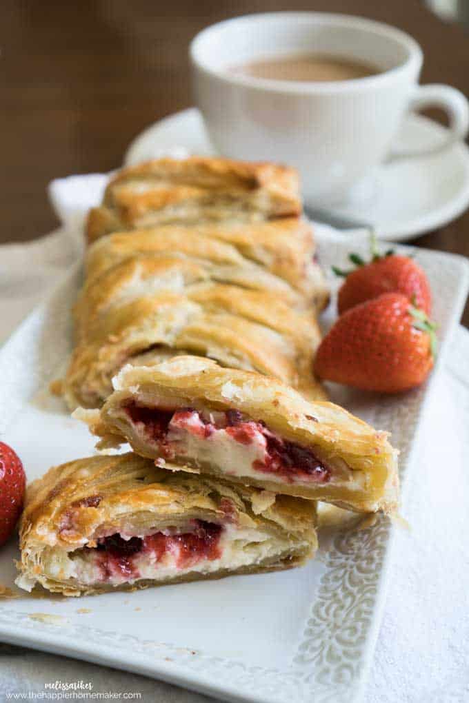 strawberry cream cheese danish sliced on white platter