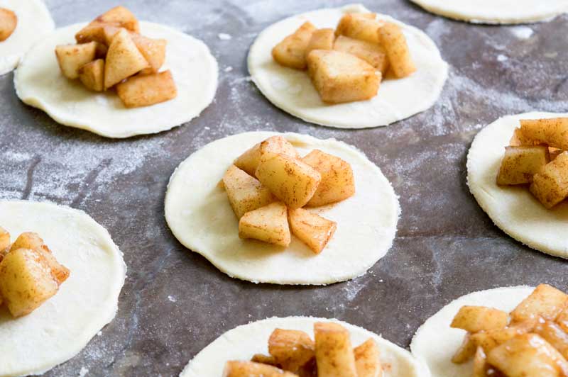 circles of coughh with apple pie mixture on top