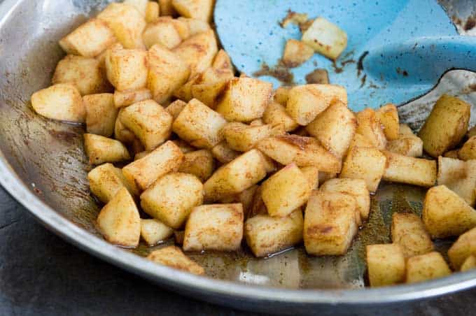 diced apples with cinnamon butter and brown sugar to make Apple Hand Pies filling