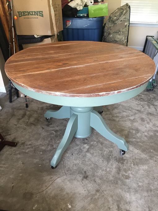 round table with paint stripped off the top