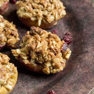 A close up of baked apples with oatmeal crisp