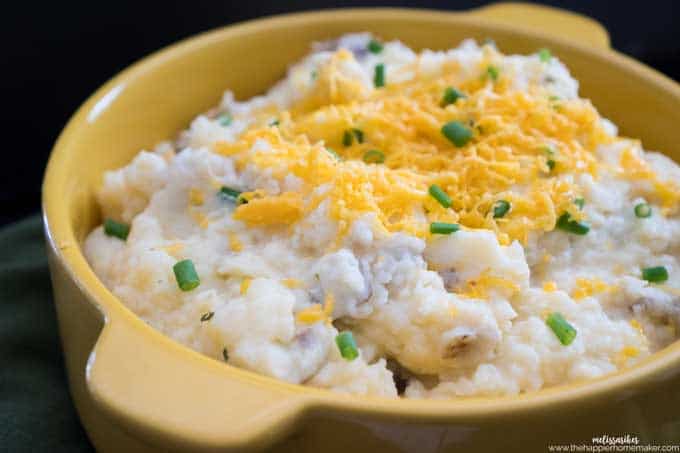 Cheddar Chive Mashed Potatoes in yellow casserole dish