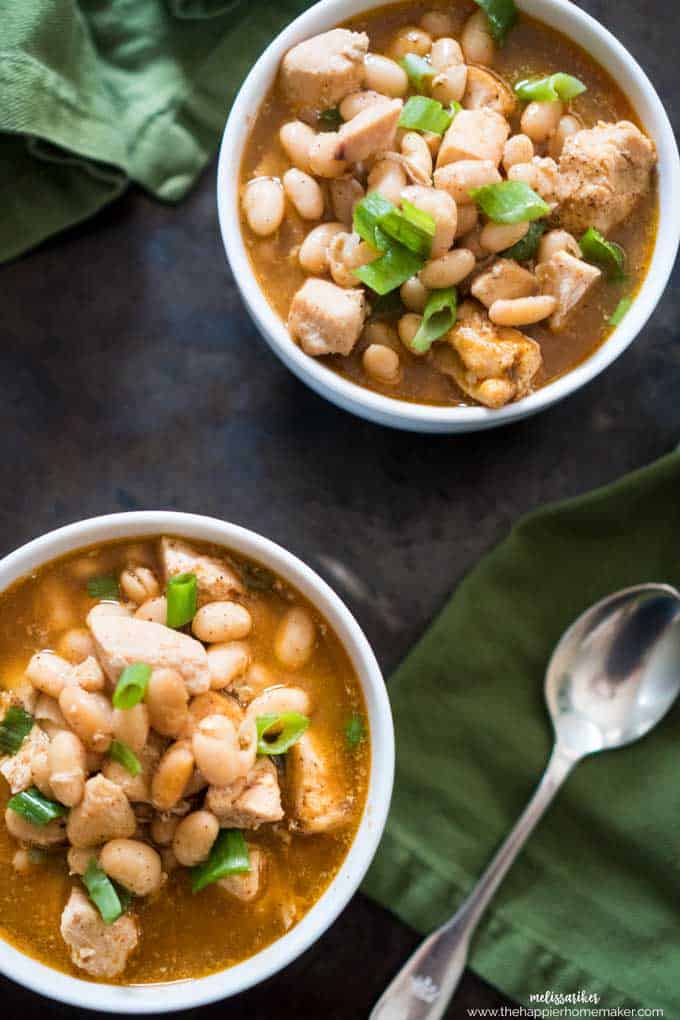 Two bowls of while chicken chili with green onion