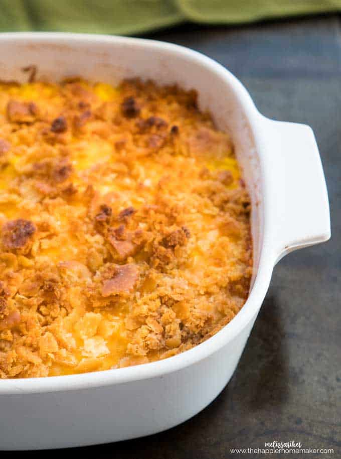 corn pudding with cracker topping in white casserole dish