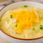 close up of bowl of cheesy mashed potatoes