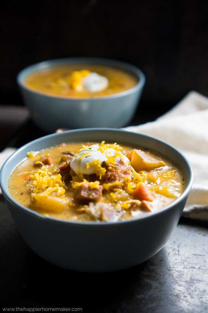 bowl of cheesy bacon, ham and potato soup