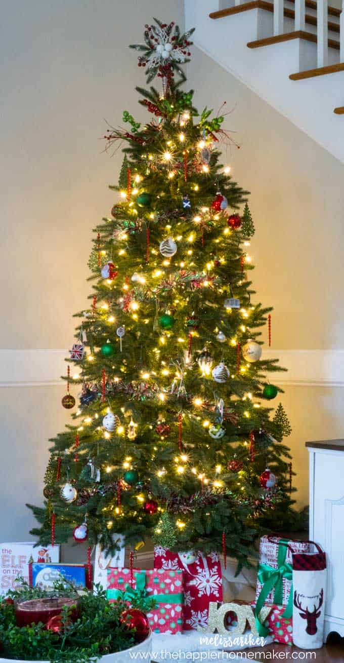 A close up of a Christmas tree that has lights and decorations on it