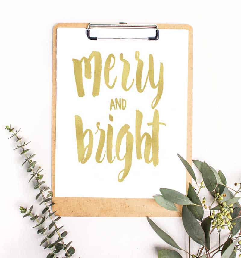 A close up of a sign that says Merry and Bright