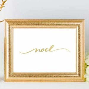 hand lettered noel printable art in gold frame
