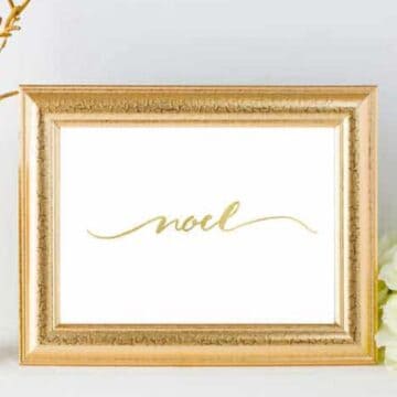 hand lettered noel printable art in gold frame
