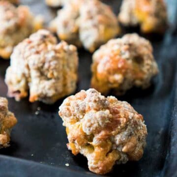 sausage cheese balls on baking sheet