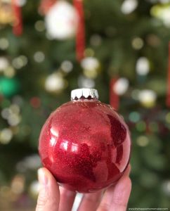 A close up of a red Christmas ornament