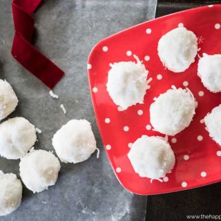 Gluten free coconut snowballs on a red and white plate