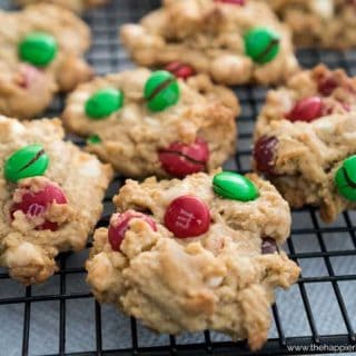 A close up of chocolate chip cookies with green and red M&Ms