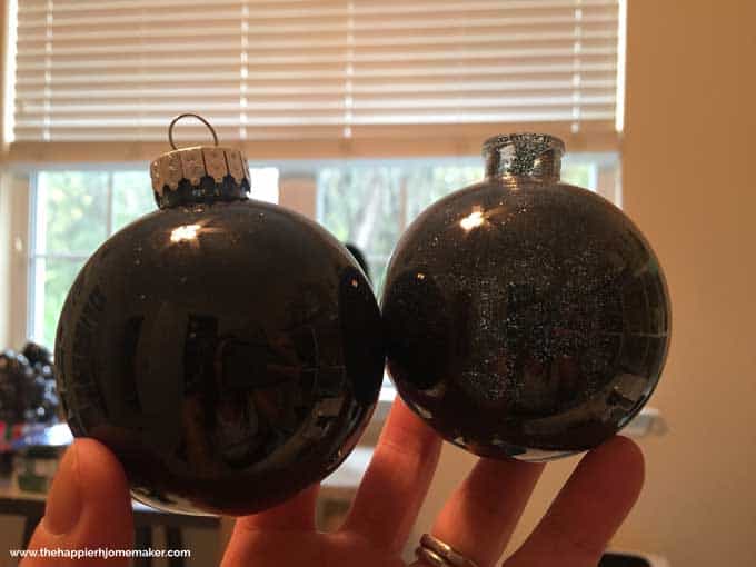 Two dark black glass, glitter ornaments.