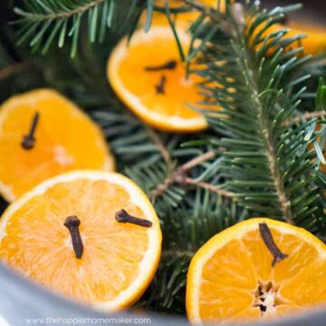 orange slices, cloves, and pine sprigs