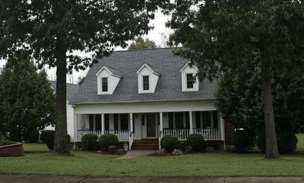 white two story home with porch