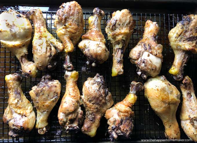A close up of baked chicken drumsticks