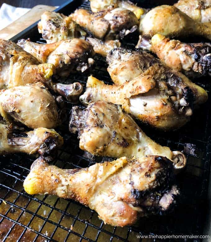 A close up of baked chicken drumsticks