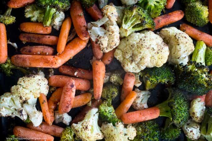 A close up of roasted vegetables including broccoli, cauliflower and carrots