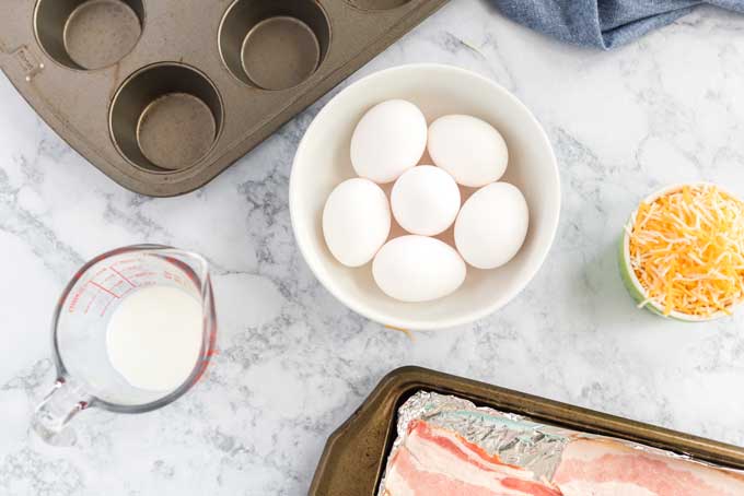 eggs milk bacon muffin tin on counter