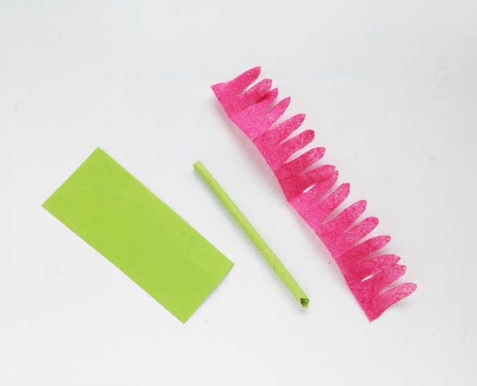green cardstock rolled into stem for diy rose and tissue paper scallop cut for flower petals