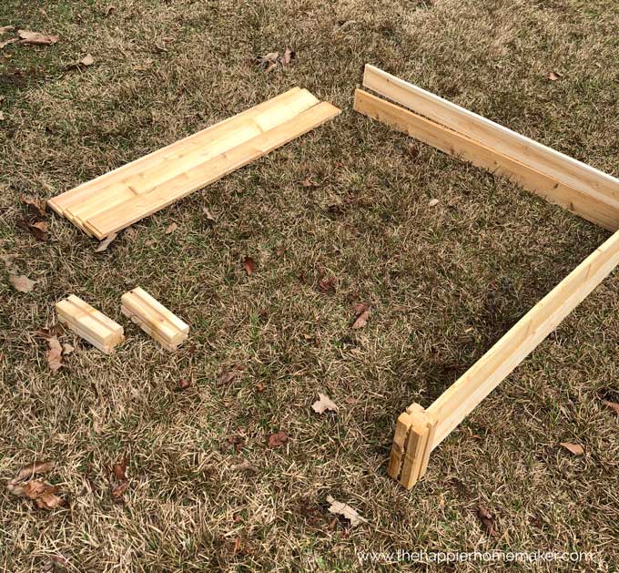pieces of raised garden bed on dead grass