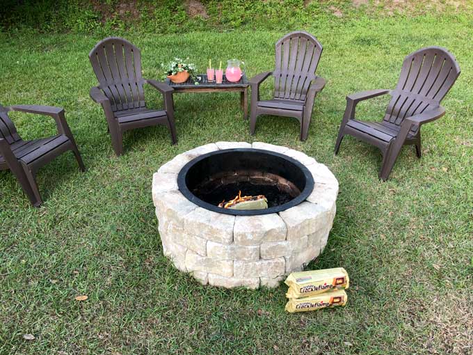 Adirondack chairs near stone fire pit