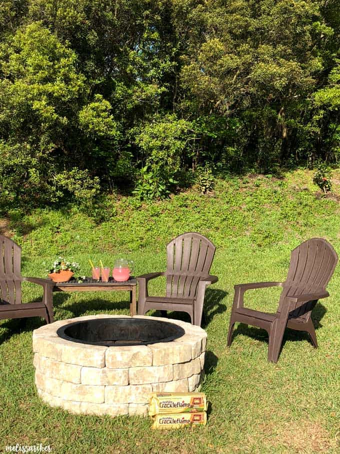 Adirondack chairs near stone fire pit