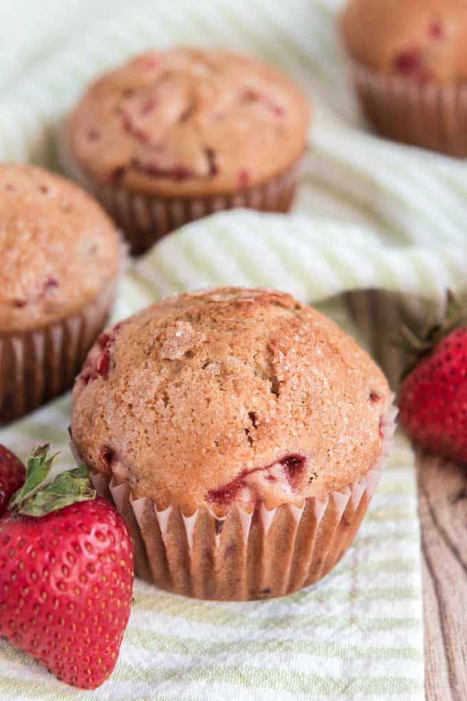 homemade strawberry muffins on green napkin