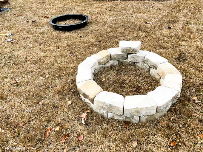 fire pit stones being stacked in a circle