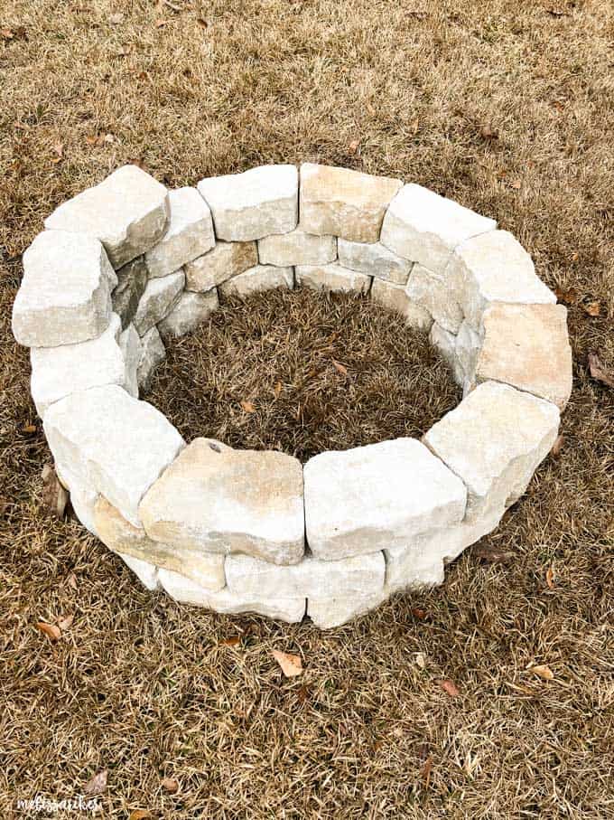 fire pit stones being stacked in a circle