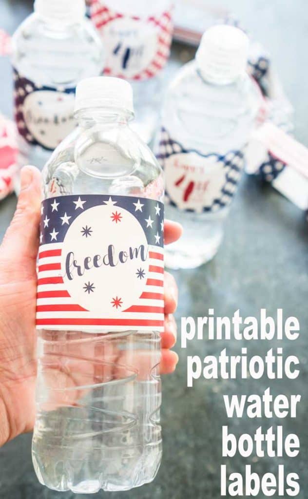 A close up of a water bottle with red white and blue wrap reading freedom