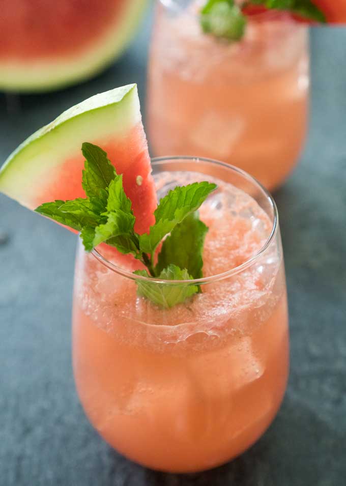 watermelon cucumber cocktail with watermelon and mint garnish