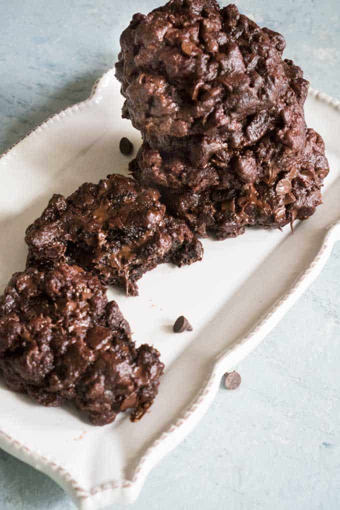 overhead view of chocolate cookies on white plate