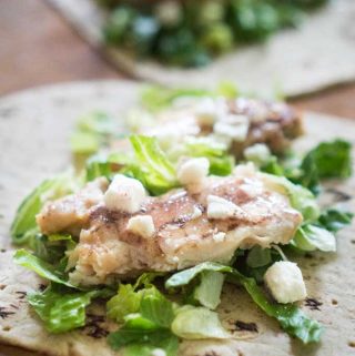 chicken caesar wrap on tortilla before folding