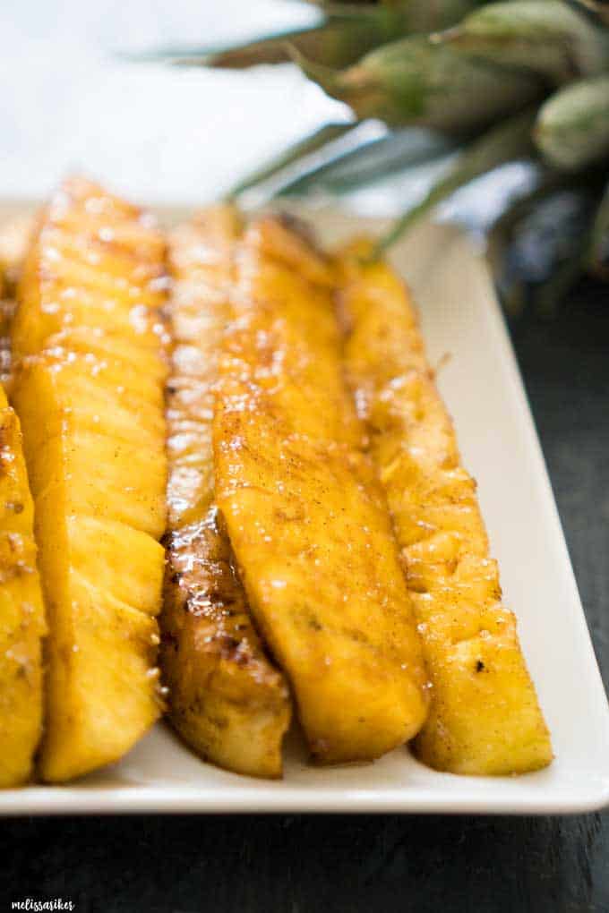 brown sugar grilled pineapple spears on white plate