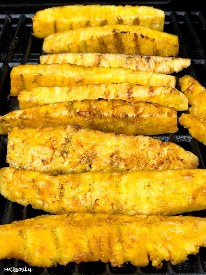 close up of pineapple spears on grill